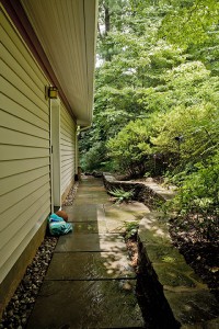 NEW GARAGE REQUIRED WATER MANAGEMENT ON STEEPLY SLOPED SIDE YARD. ACCESS DOORBELL FOR CHILDRENS’ TRAFFIC.