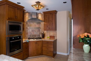 STRUCTURAL HOOD, SLATE/TILE ACCENT CONTINUE IN WRIGHTIAN SENSIBILITY.