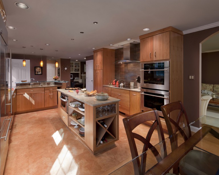 VIEW OF KITCHEN ISLAND STORAGE AND HOOD