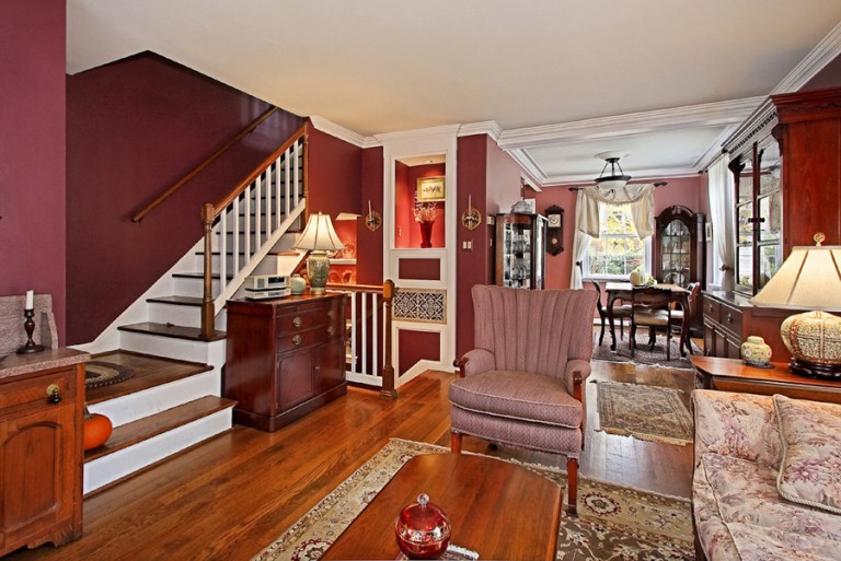 VIEW OF LIVING ROOM AND STAIRWELL